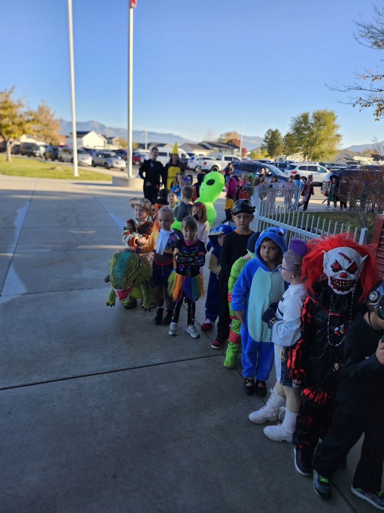 1st grade class walking in the halloween costume parade