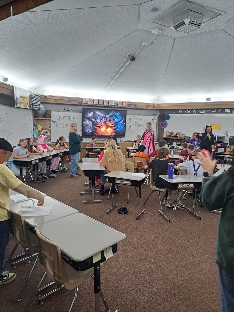 A collection of photos showing elementary students in various Halloween costumes participating in classroom parties. The images include students doing art projects, making snacks, drinking punch, and playing games with their teachers and parent volunteers.
