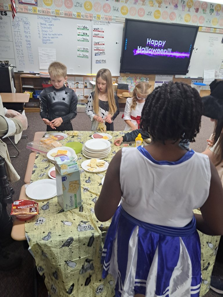 A collection of photos showing elementary students in various Halloween costumes participating in classroom parties. The images include students doing art projects, making snacks, drinking punch, and playing games with their teachers and parent volunteers.