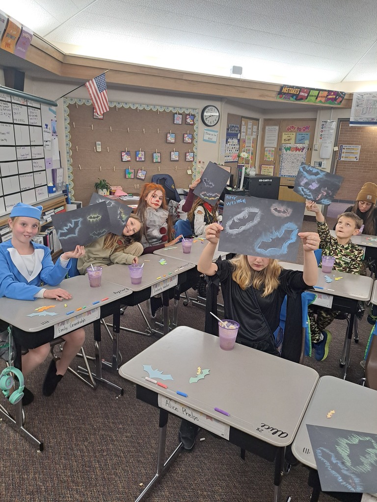 A collection of photos showing elementary students in various Halloween costumes participating in classroom parties. The images include students doing art projects, making snacks, drinking punch, and playing games with their teachers and parent volunteers.