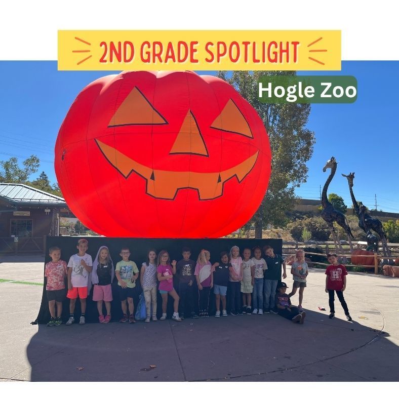 2nd grade spotlight: Hogle zoo. students at the zoo in front of a giant jack o'lantern
