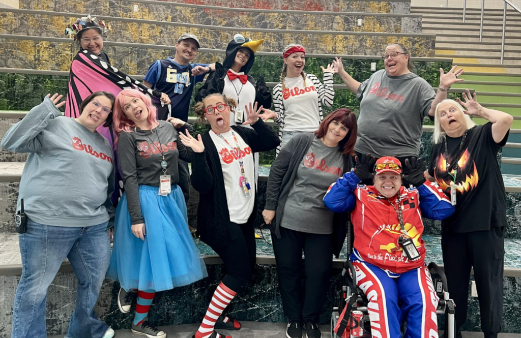 all of the support staff dressed up in their costumes for halloween