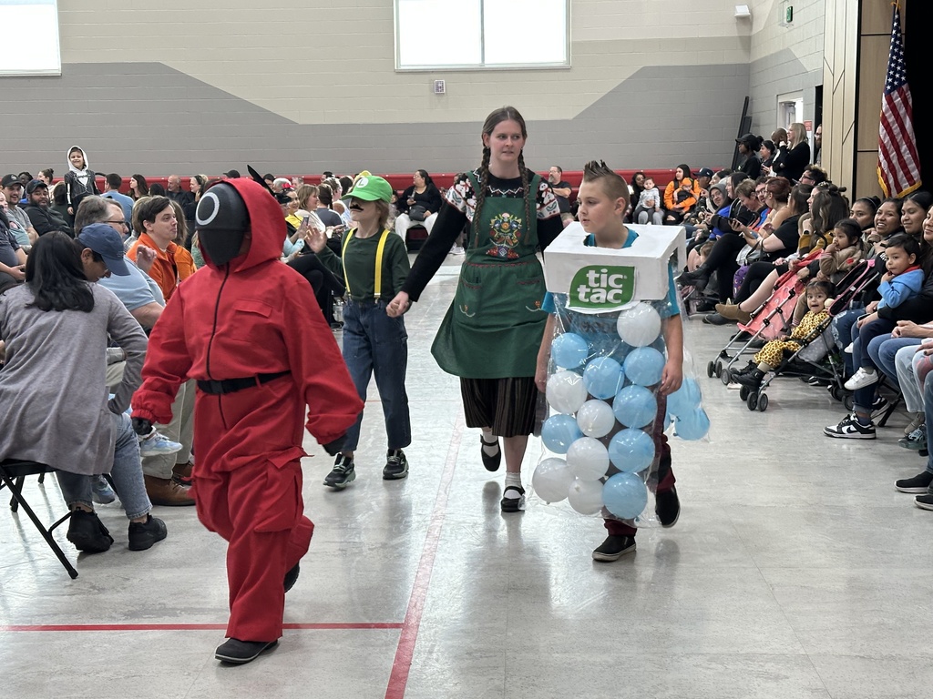 students walking in the halloween parade