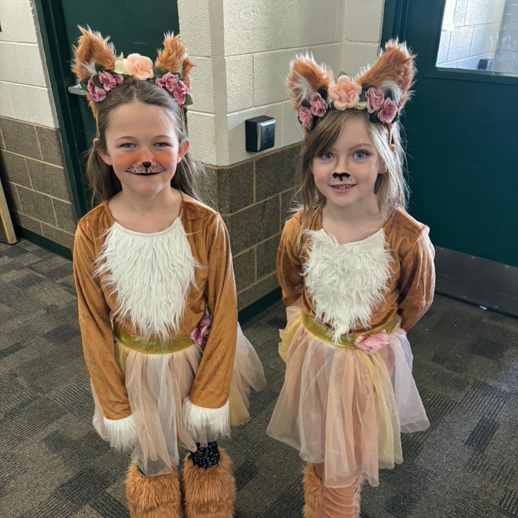 two girls in cat costumes
