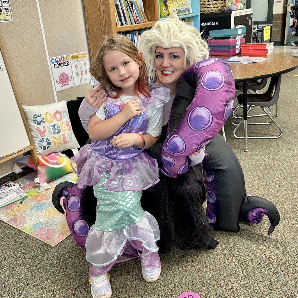 Mrs. Jacobsen dressed as Ursula and a girl dressed like Ariel from Little Mermaid.