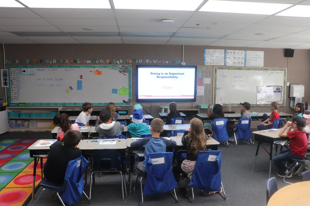 2nd graders going through the voting process