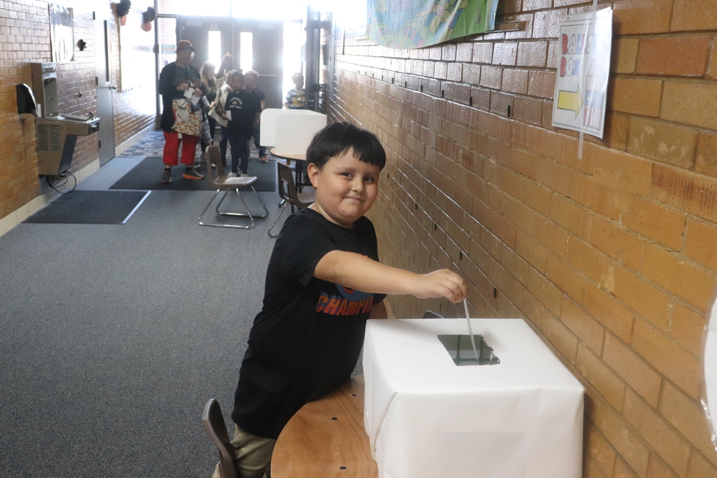 2nd graders going through the voting process