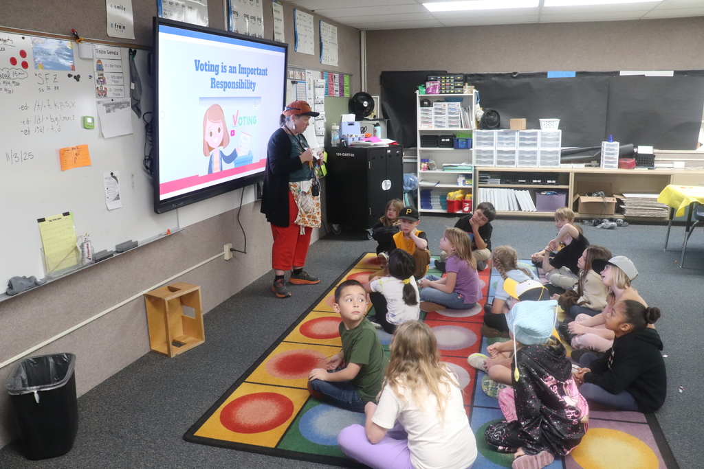 2nd graders going through the voting process