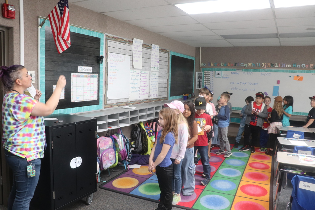 2nd graders going through the voting process