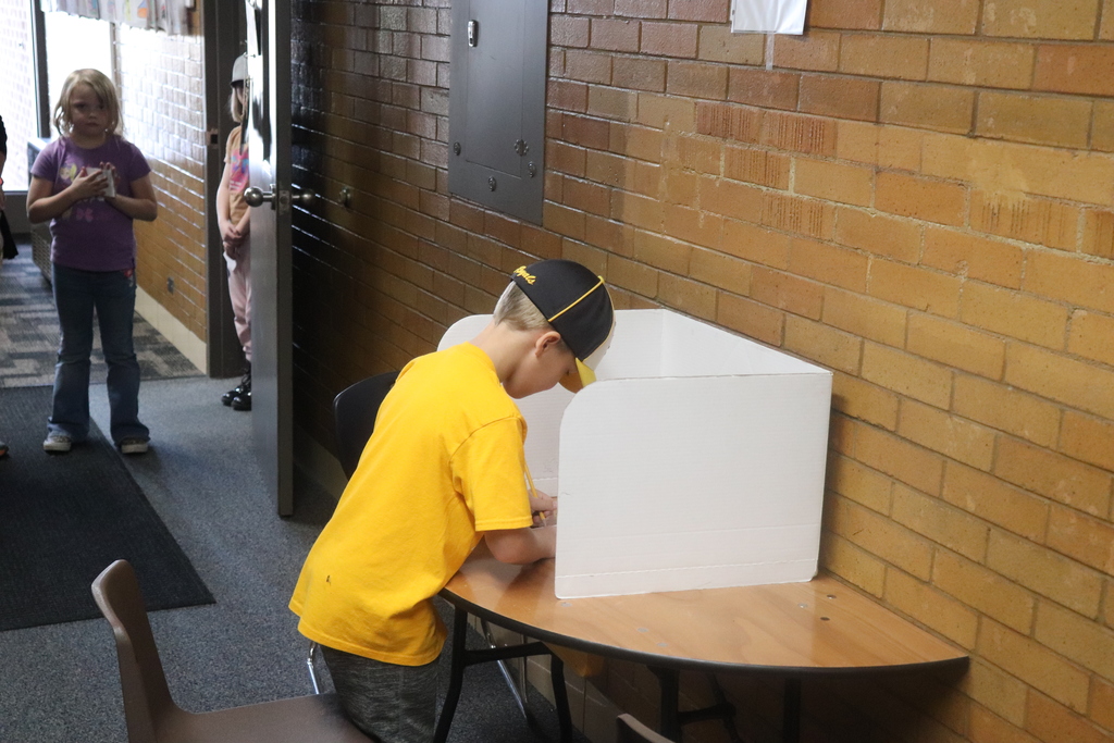 2nd graders going through the voting process