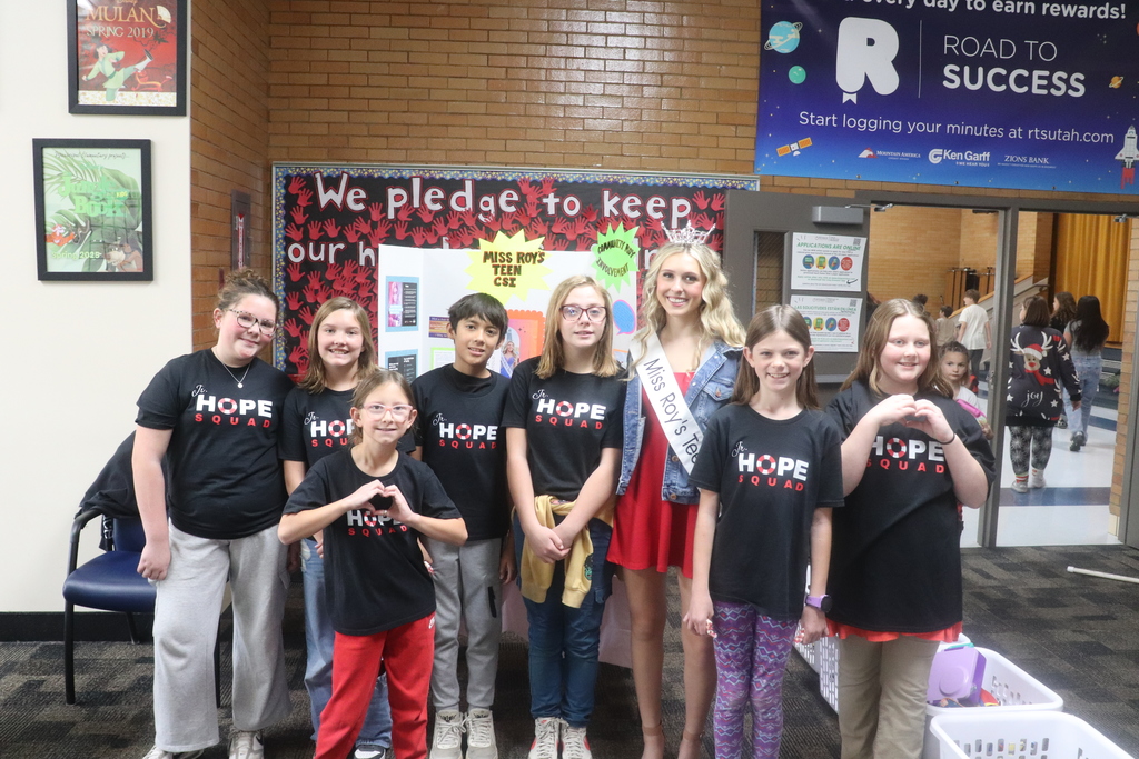 students posing for red ribbon week photos , pledging to be drug free