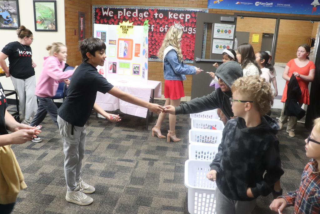 students posing for red ribbon week photos , pledging to be drug free