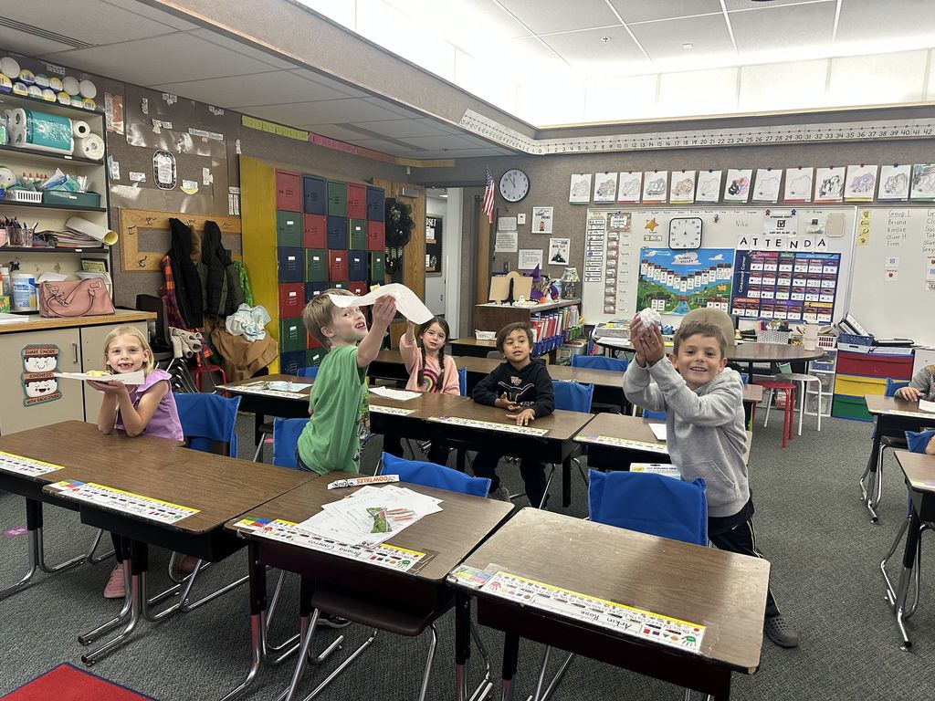 Mrs. Taurone class earing their reward playing soccer and eating donuts.