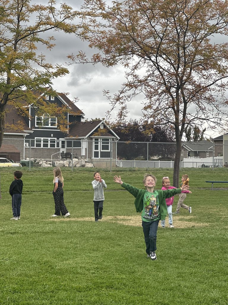 Mrs. Taurone class earing their reward playing soccer and eating donuts.