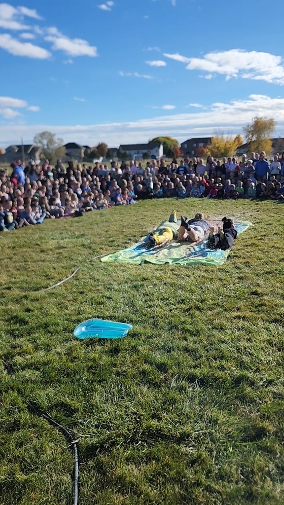 Mr. Lott, Mr. Talbot, Mrs. Watkins taking an Encore slide on the Pudding Slip N Slide  after the kids chanted "Encore" 
