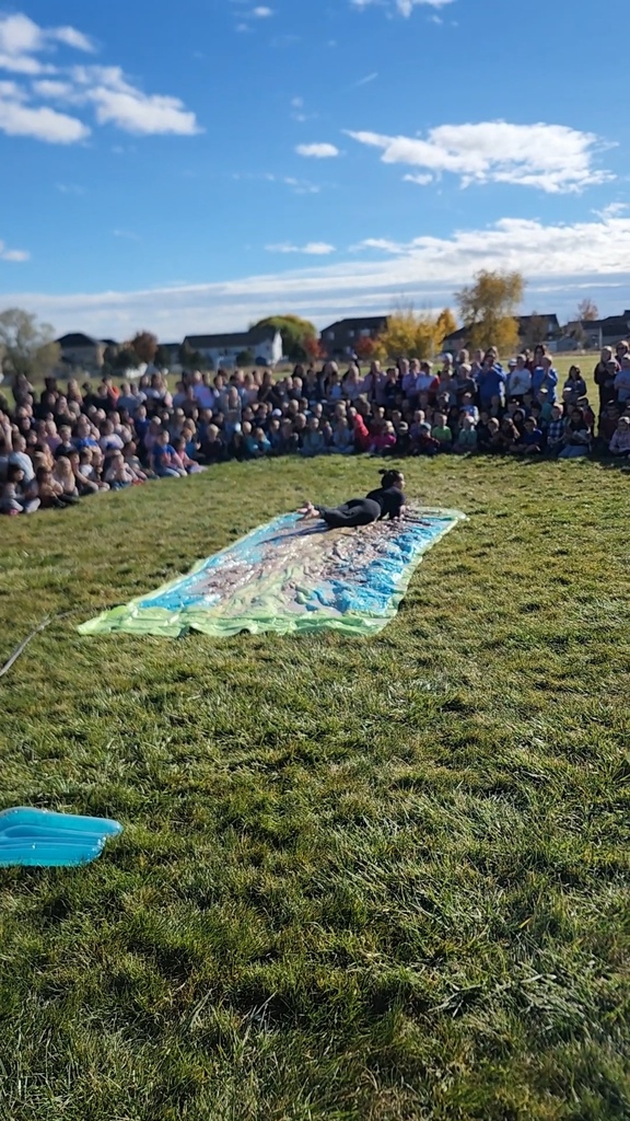 Mrs. Watkins taking  the sticky plunge on the pudding Slip N Slide. What a Slide!
