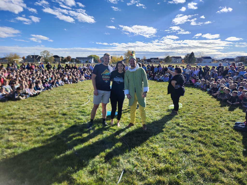 Mr. Lott, Mr. Talbot, Mrs. Watkins getting ready to slide down the pudding slip N slide. 