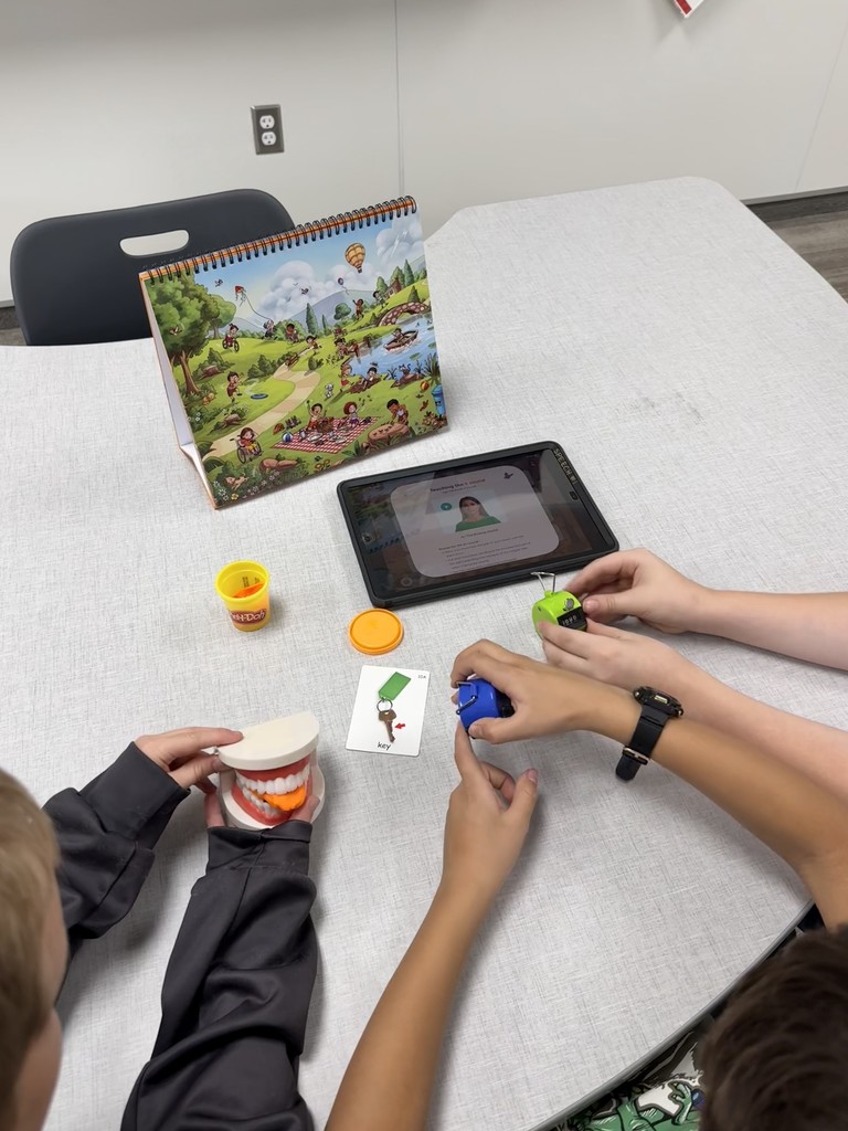 students using different speech tools to help them know how to ask and answer questions.