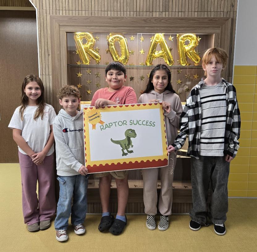 students holding a certificate for the awards they received