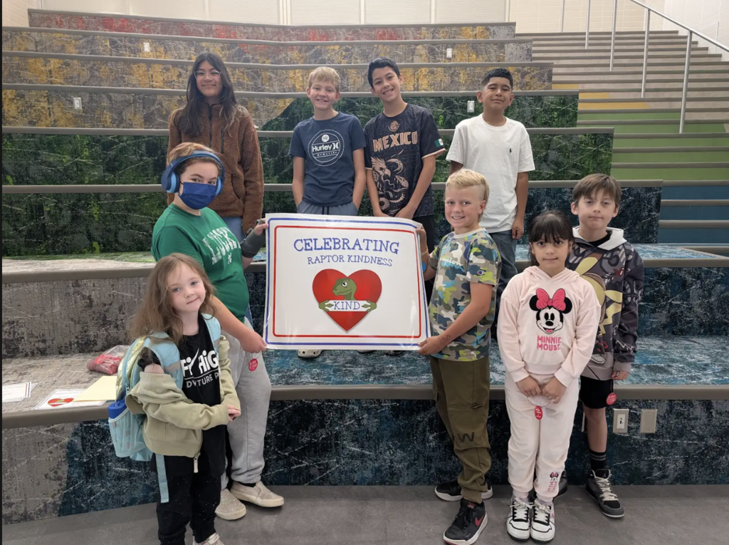 students holding a certificate for the awards they received