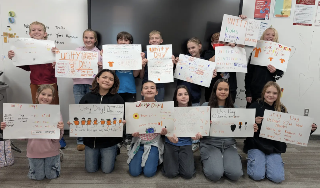 The hope squad with the posters that they created for unity day