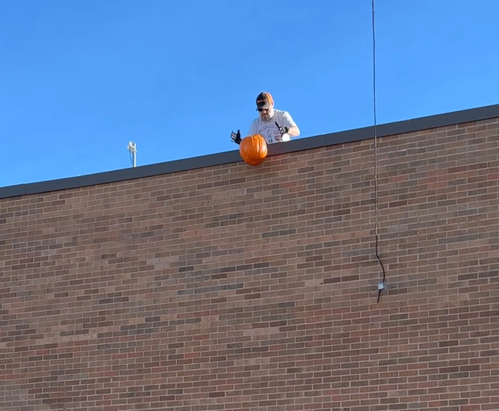 Mr Brad Dropping pumpkin from the roof