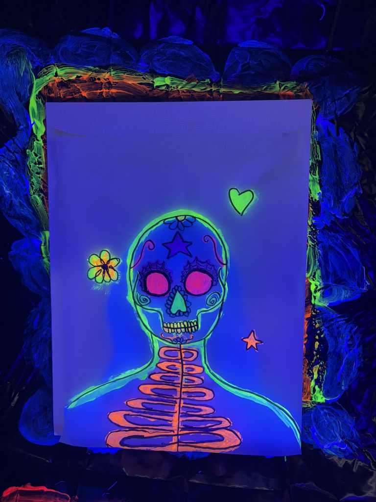 Blacklight Painting- All 2D Art students spent the week in painting in the dark! Art 1 students learned about Dia de los Muertos last week and painting skeleton portraits using colors and symbols that represent themselves and their ancestors. Art 2 students used different colors to draw each other in poses and gestures focusing on value with the different colors. Finally, Art 3 students practiced making their first mural by making an ofrenda that students could hang their completed skeletons on. 
