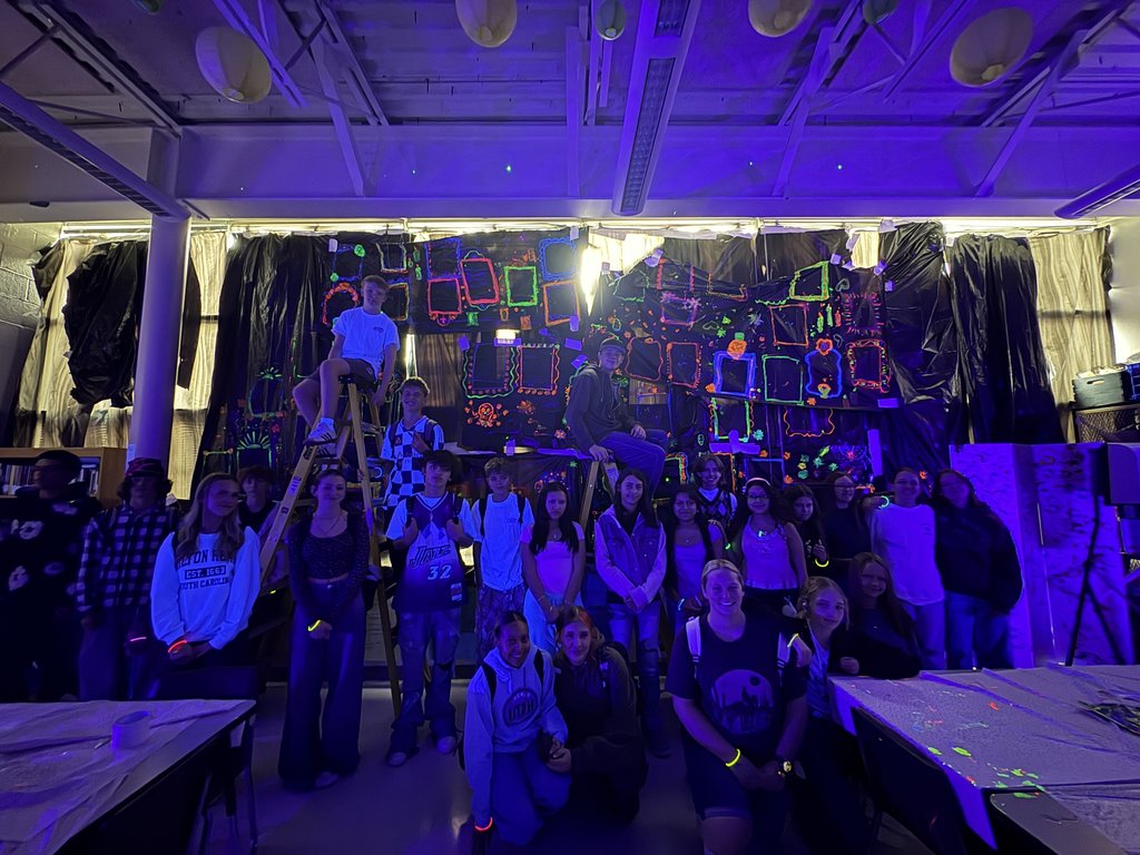 Blacklight Painting- All 2D Art students spent the week in painting in the dark! Art 1 students learned about Dia de los Muertos last week and painting skeleton portraits using colors and symbols that represent themselves and their ancestors. Art 2 students used different colors to draw each other in poses and gestures focusing on value with the different colors. Finally, Art 3 students practiced making their first mural by making an ofrenda that students could hang their completed skeletons on. 