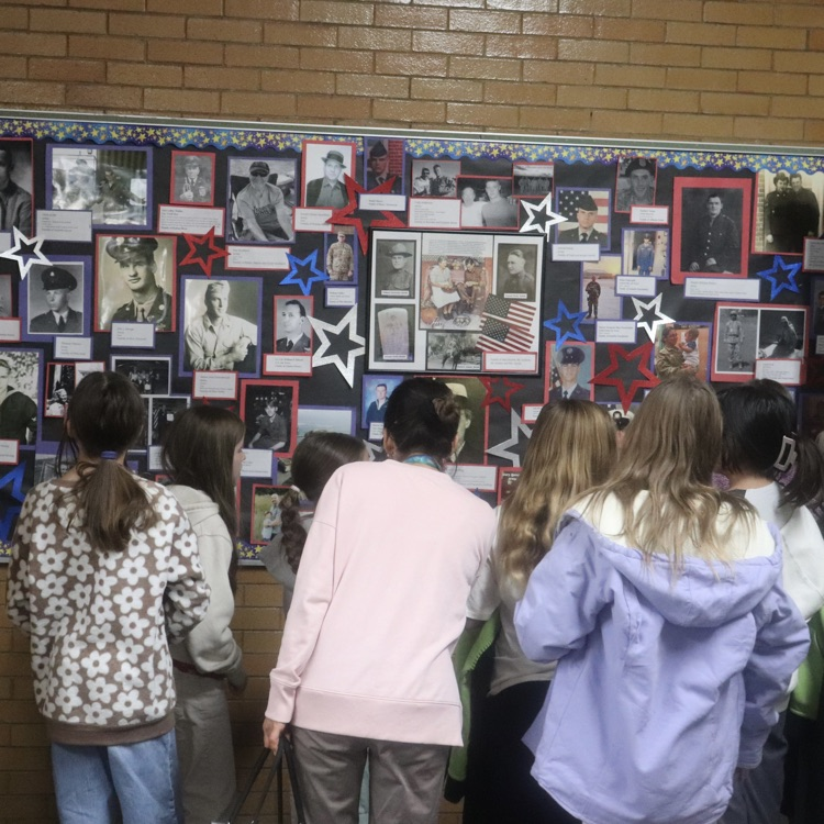 students looking at honor wall