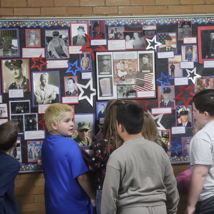 students looking at honor wall 