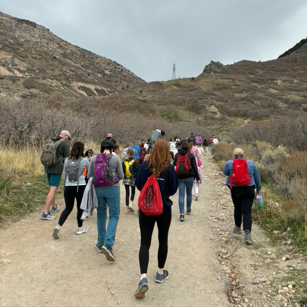 Kids hiking up to the flag