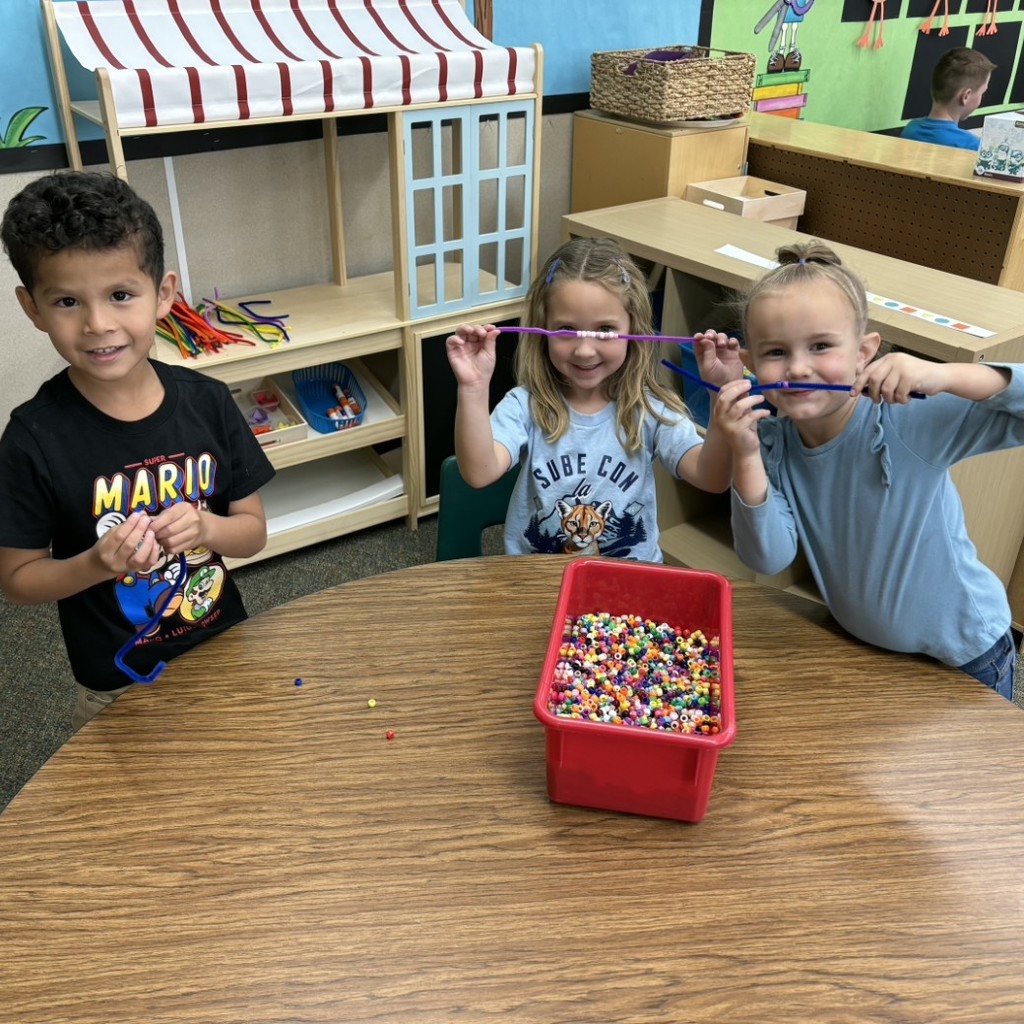 Kids stringing beads