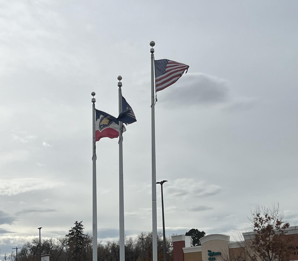 American, Utah, and Seal flags flying