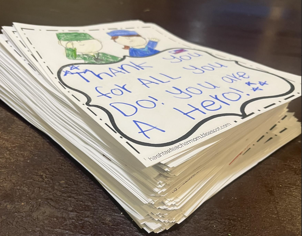 a large stack of notes that students created to give to veterans in our community