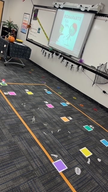 Boneparte falls apart is presented on the screen and different pictures and bones are on the floor