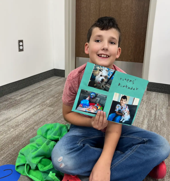 student with a project that he made