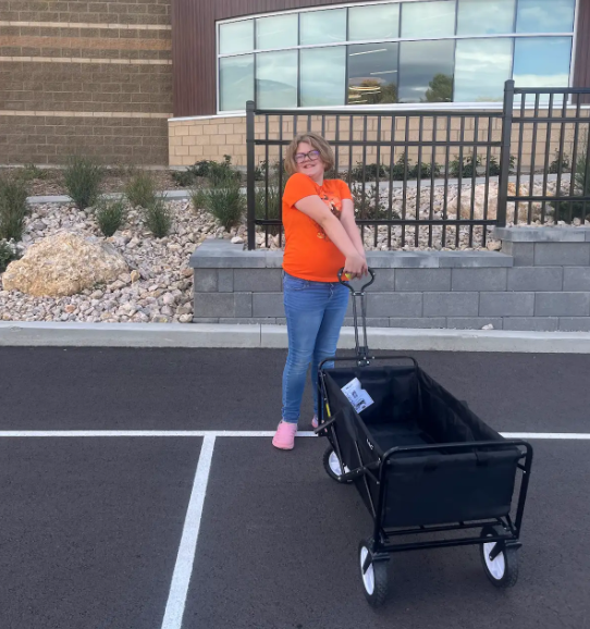 student pulling a wagon