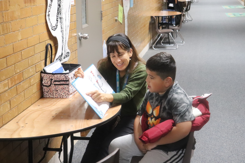 Aides helping students