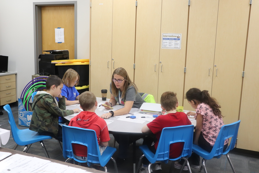 Aides helping students