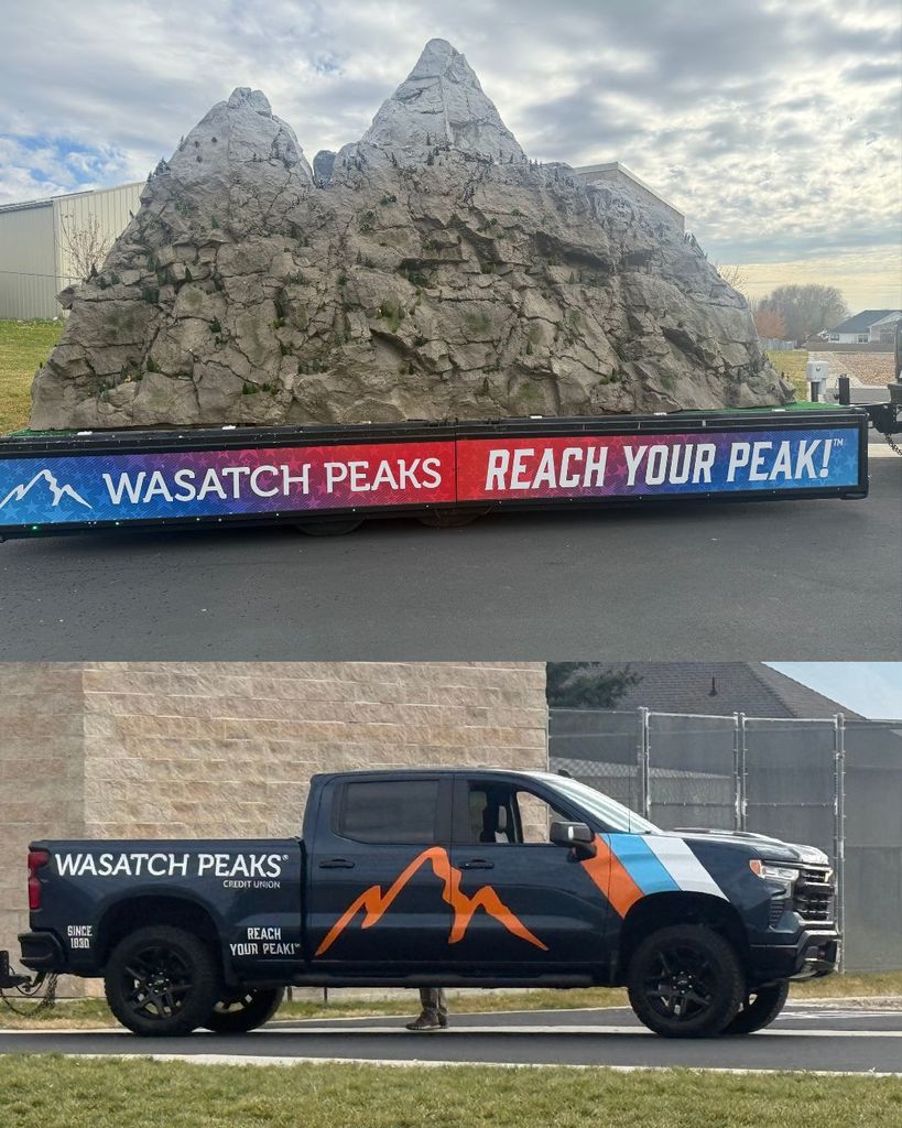 Photos showing a large, realistic model of a mountain peak mounted on a flatbed trailer labeled 'Wasatch Peaks - Reach Your Peak!' Student classes are gathered outside, standing in front of the mountain display, smiling and posing with their teachers.