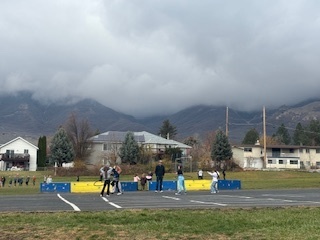 Students hula hooping on the black top at recess with Rad Dads