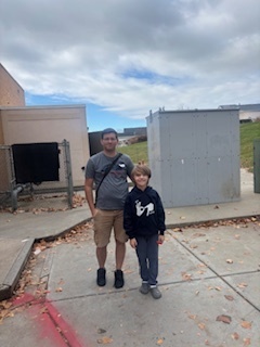 A student with his Rad Dad heading out to recess.