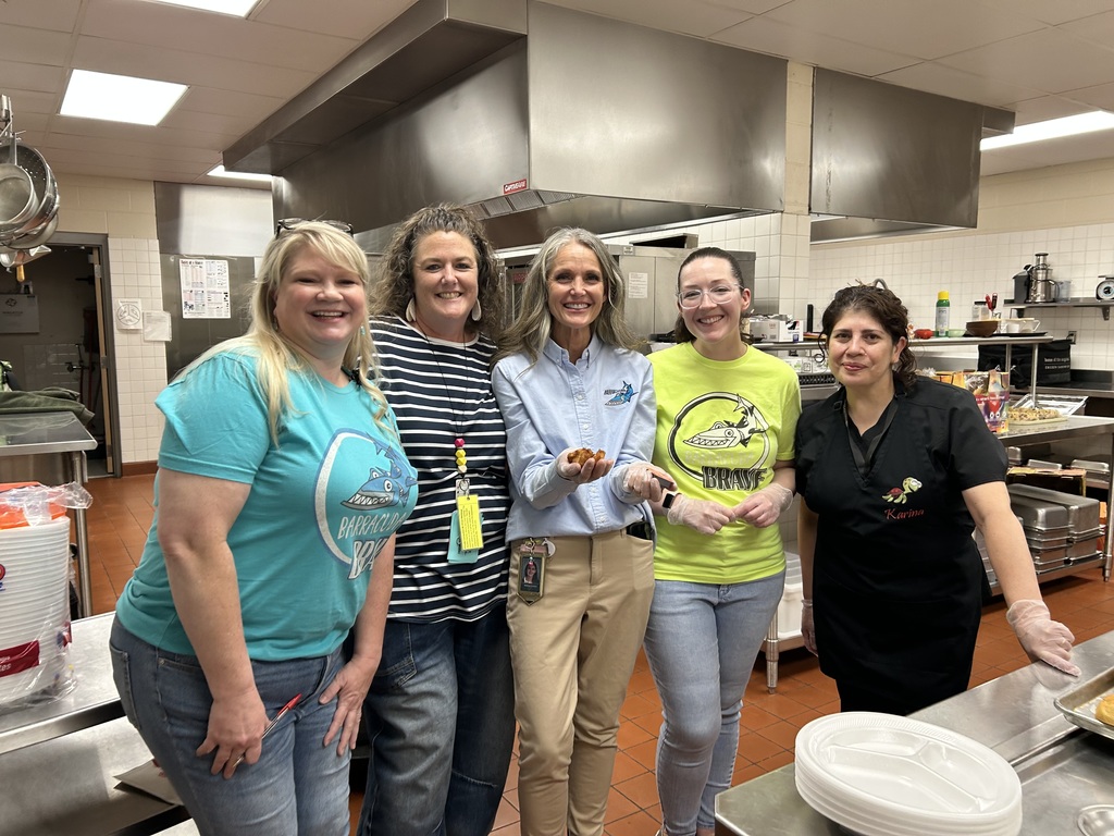 Our amazing teachers and kitchen workers serving dinner.