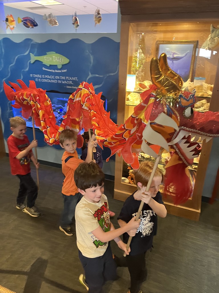 Students act out a play in costumes