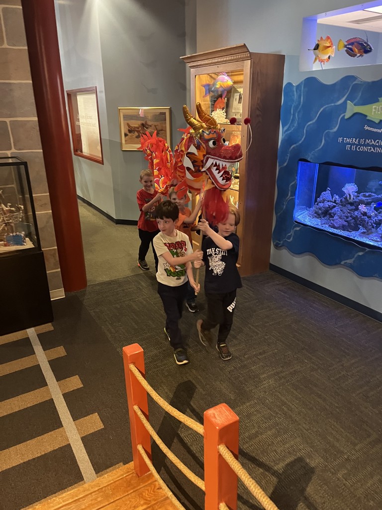 Students act out a play in costumes