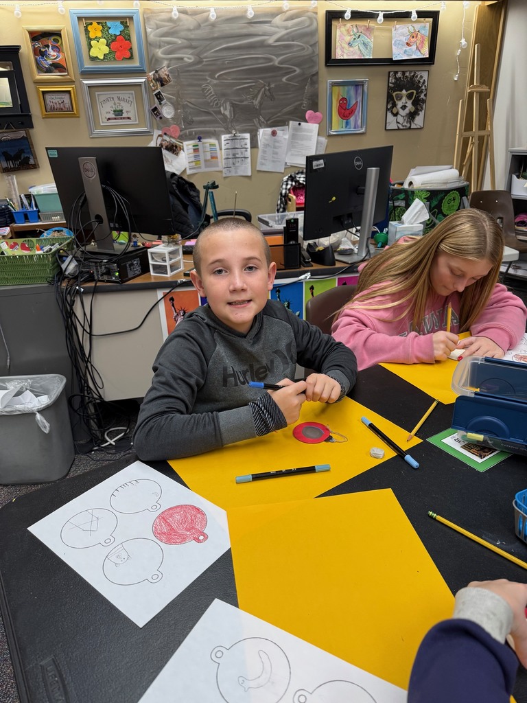 students in art making ornaments