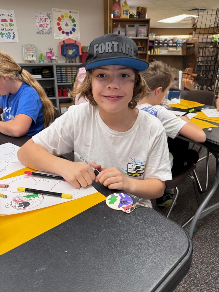 students in art making ornaments