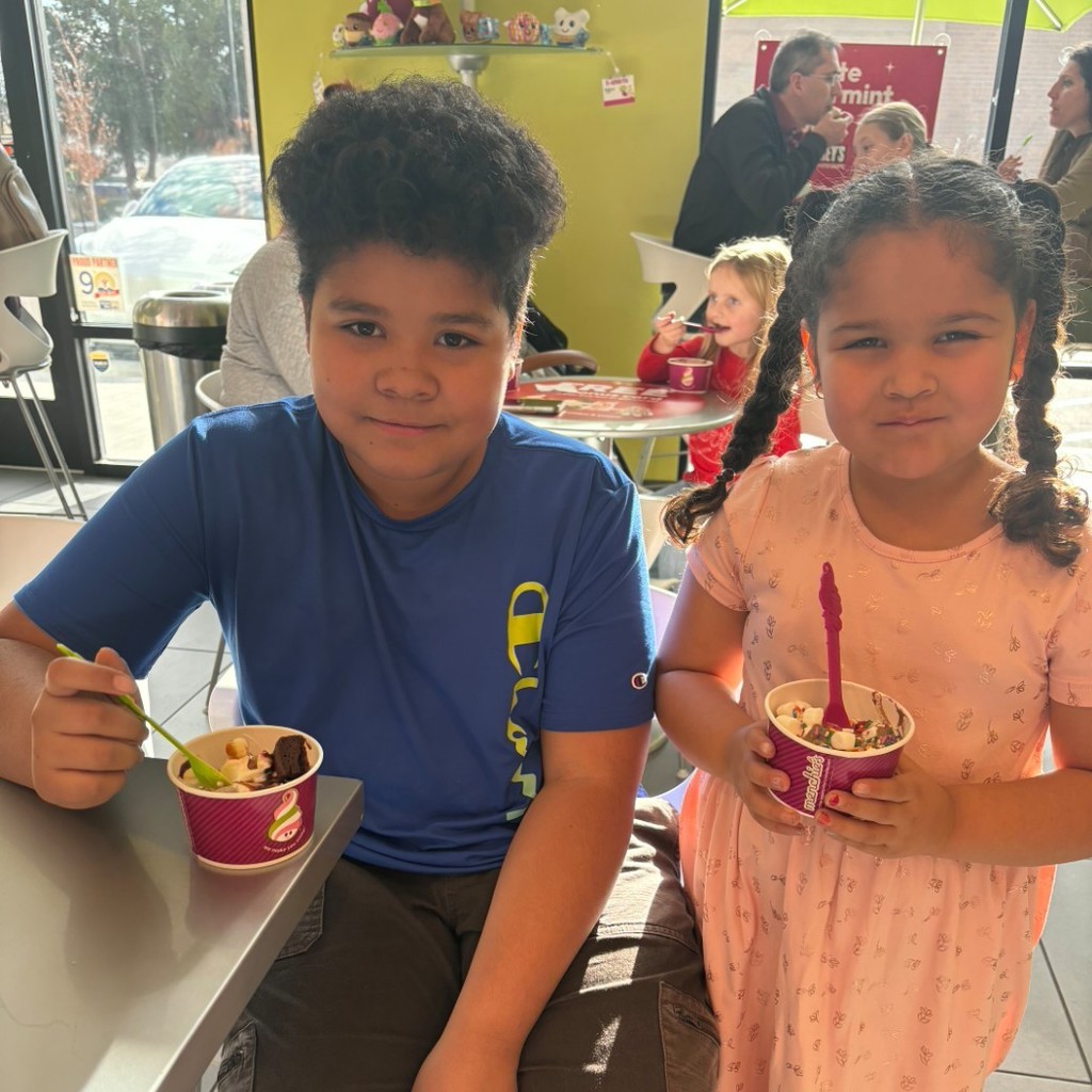a boy and girl eating icecream at Menchies