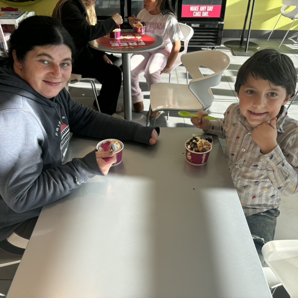 A mom and son eating icecream at Menchies