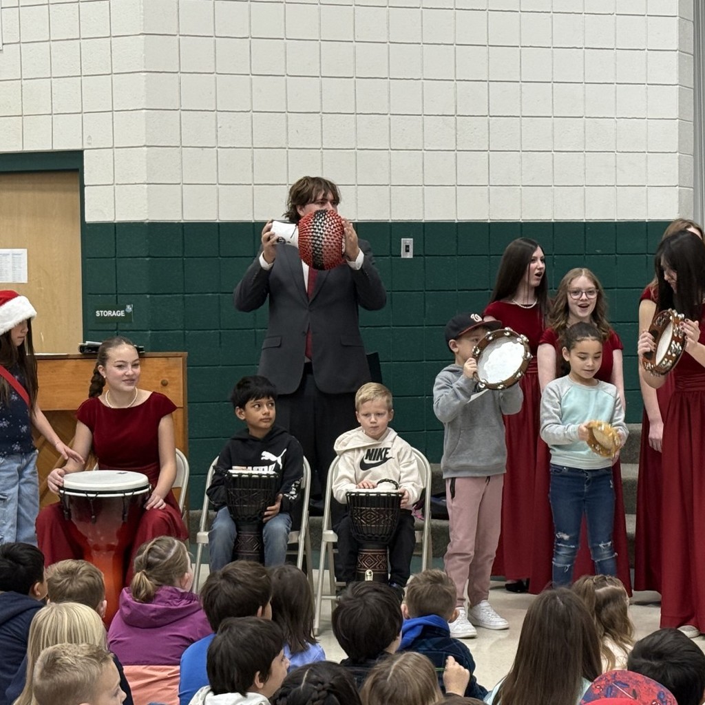 Weber High Chamber Choir playing instruments with Majestic students